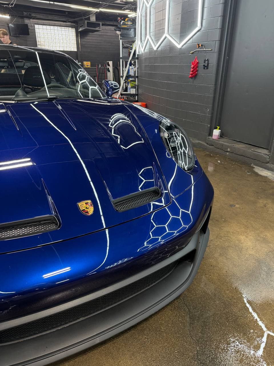 Blue Porsche GT3 hood showing crisp paint reflections