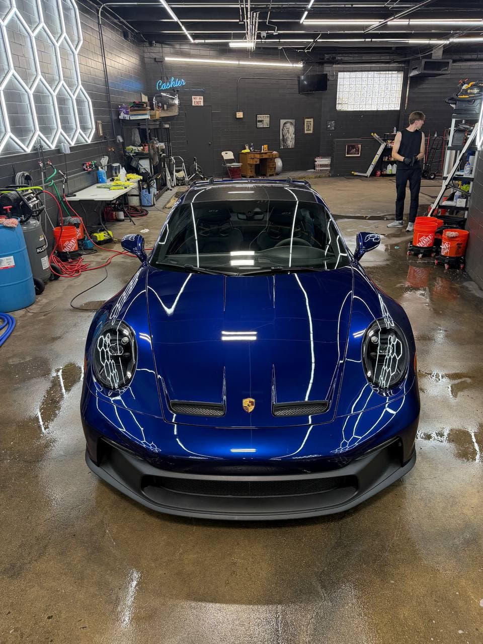 Front view of blue Porsche 911 GT3 after service