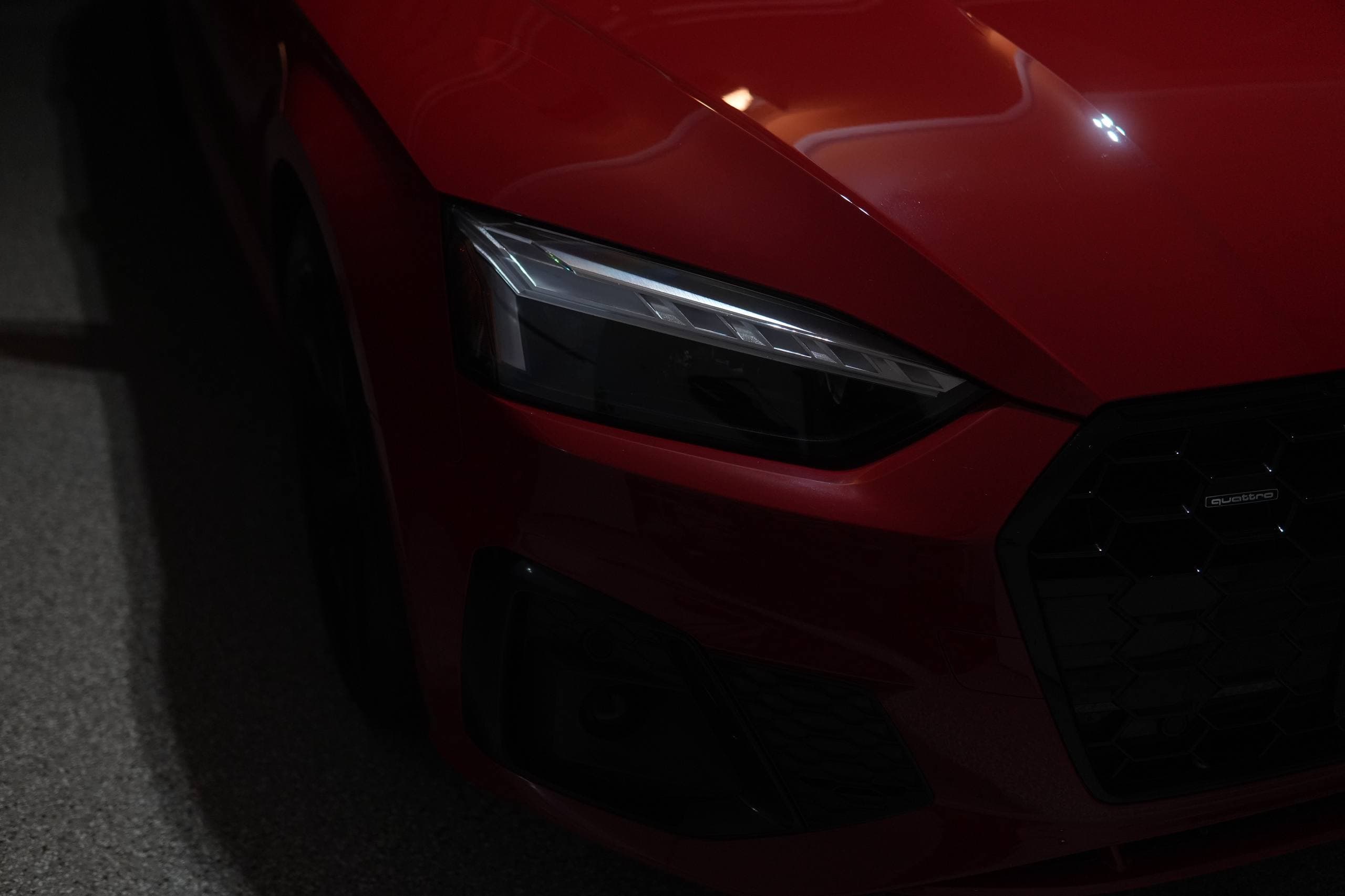 Audi side profile and puddle light after a DETAILX Chicago detail.