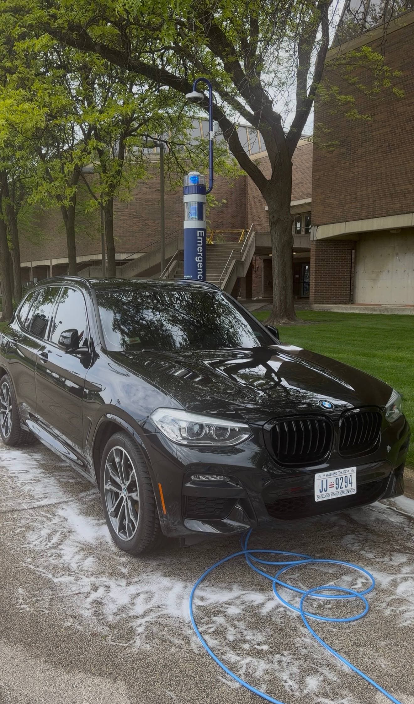 Black BMW after a DETAILX Chicago foam wash and detail.