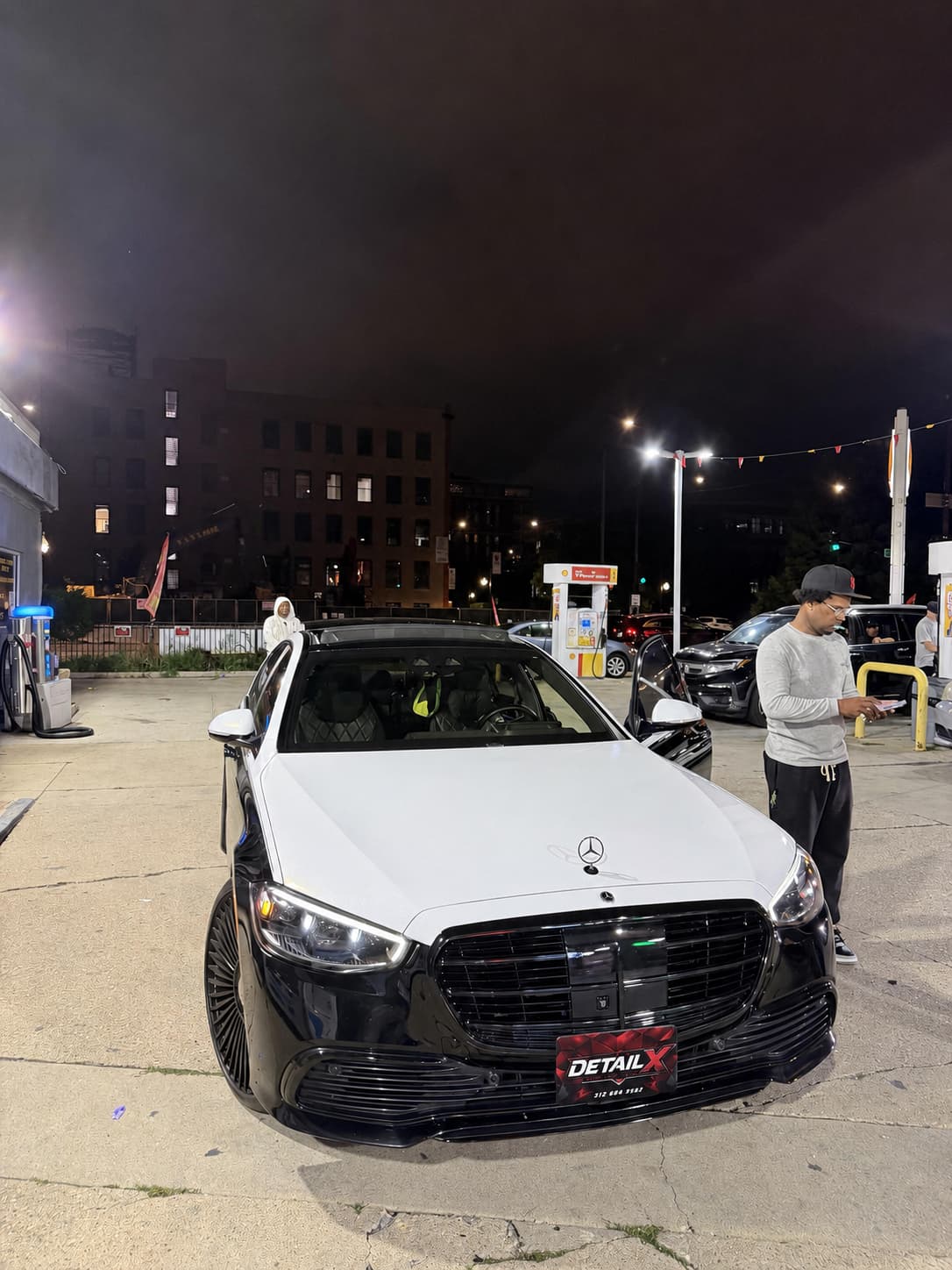 Mercedes sedan with DETAILX plate after a night detail in Chicago.